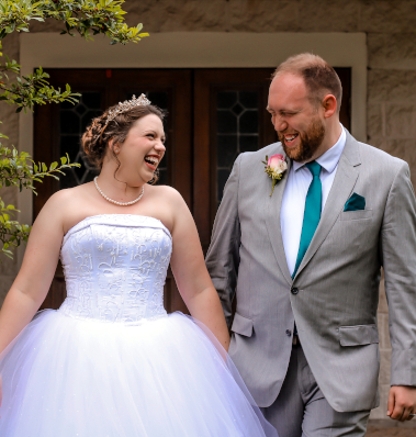 Two hearts unite as one, newlyweds bask in the sun.